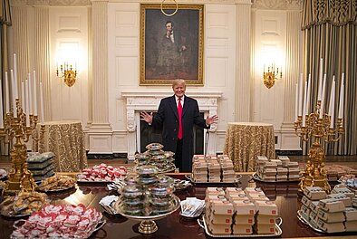 Donald Trump posing by fast food display in White House